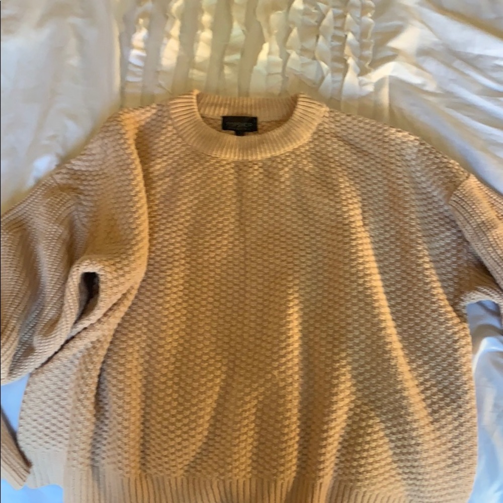 Pink top shop sweater with oversized sleeves.